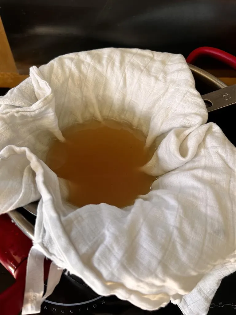 on passe au chinois et a l'étamine le vin d'orange après 40 jours de macération